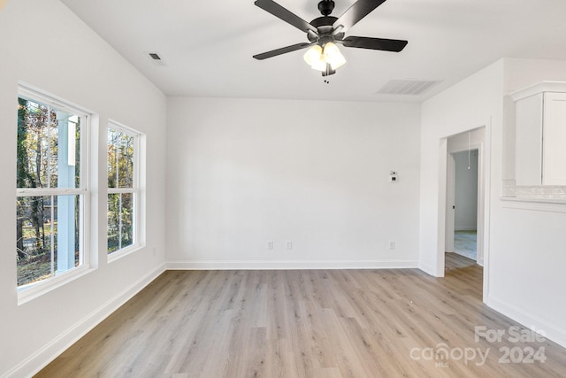 spare room featuring ceiling fan and light hardwood / wood-style floors