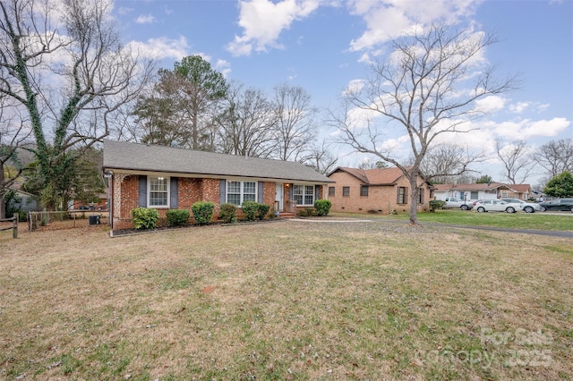 ranch-style home with a front lawn