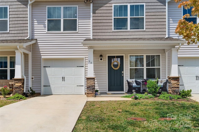 doorway to property with a garage