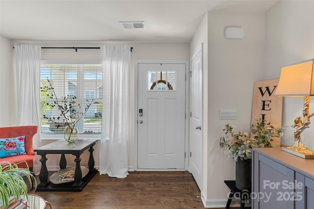 entrance foyer with dark hardwood / wood-style floors