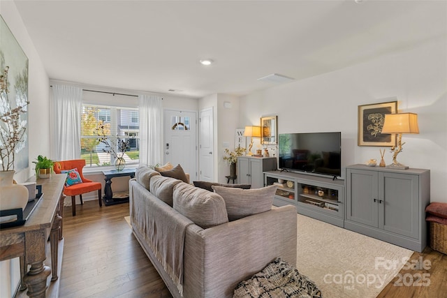 living room featuring dark hardwood / wood-style floors