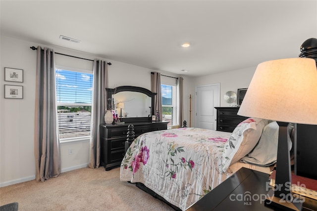 bedroom with light carpet