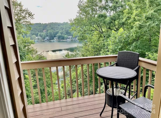 wooden terrace with a water view