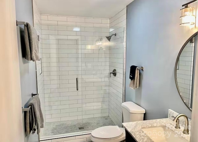 bathroom featuring vanity, toilet, walk in shower, and a baseboard radiator