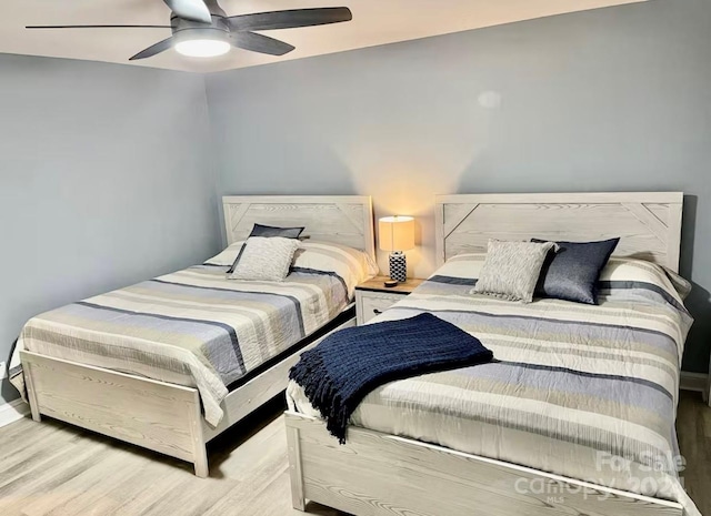 bedroom featuring ceiling fan and light hardwood / wood-style floors