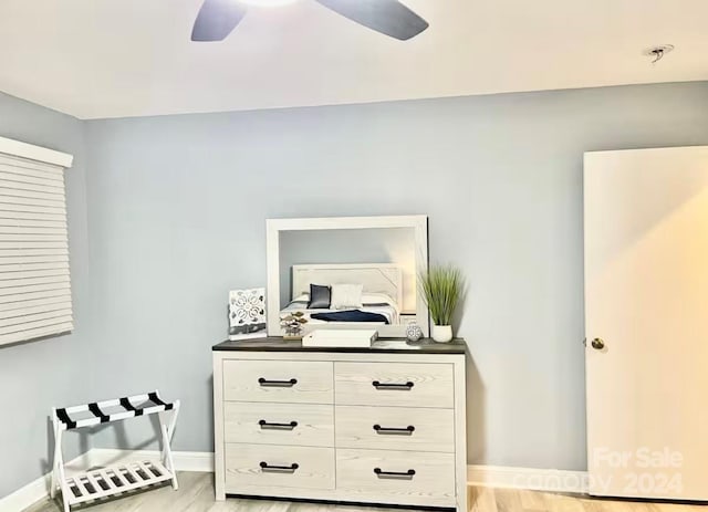 bedroom featuring ceiling fan and light hardwood / wood-style flooring