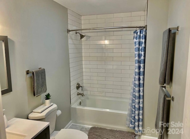 full bathroom with vanity, shower / bath combo, and toilet