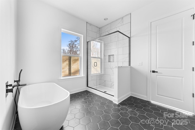 bathroom with shower with separate bathtub