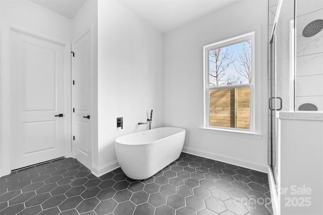 bathroom featuring shower with separate bathtub