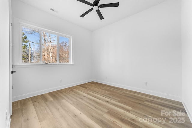 spare room featuring ceiling fan and light hardwood / wood-style flooring