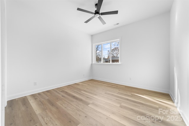 unfurnished room featuring ceiling fan and light hardwood / wood-style flooring