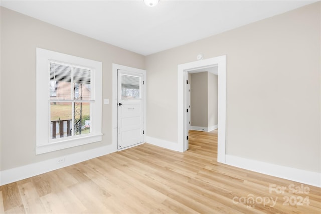 spare room featuring light wood-type flooring