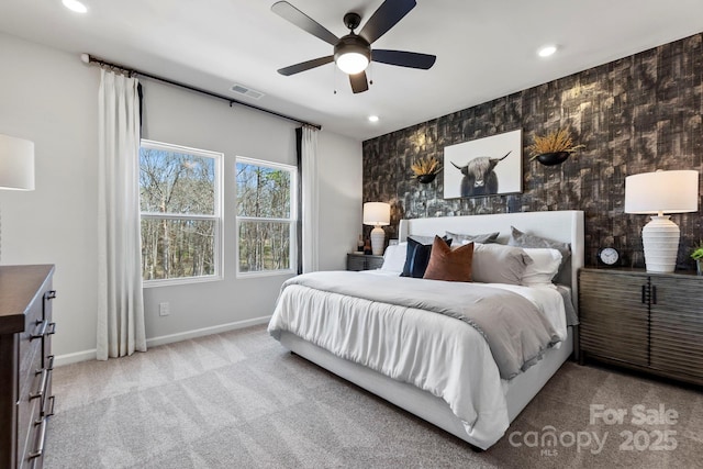 bedroom with light carpet and ceiling fan