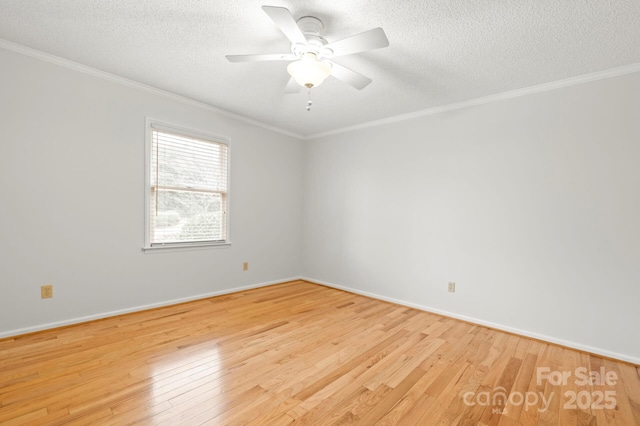 empty room with crown molding, light hardwood / wood-style flooring, and a textured ceiling