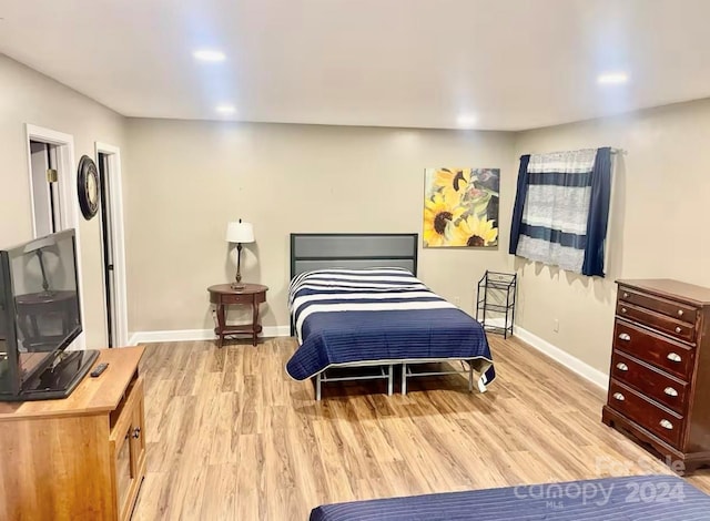 bedroom with light wood-type flooring