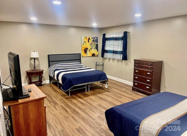 bedroom with light hardwood / wood-style flooring