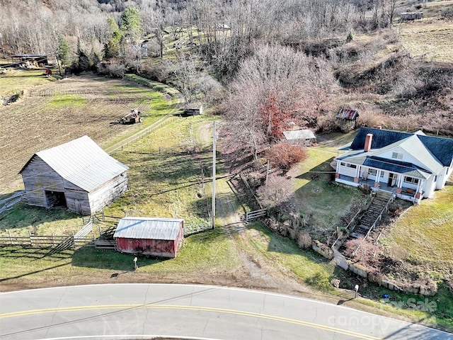 birds eye view of property featuring a rural view