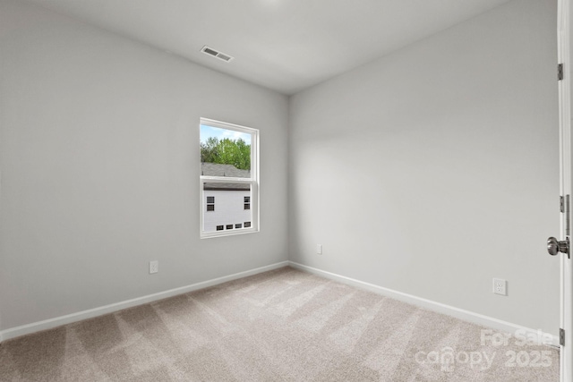 empty room featuring carpet flooring