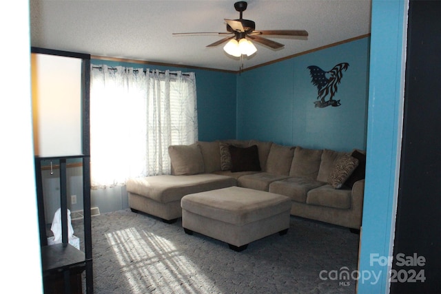 living room featuring carpet, ceiling fan, and crown molding