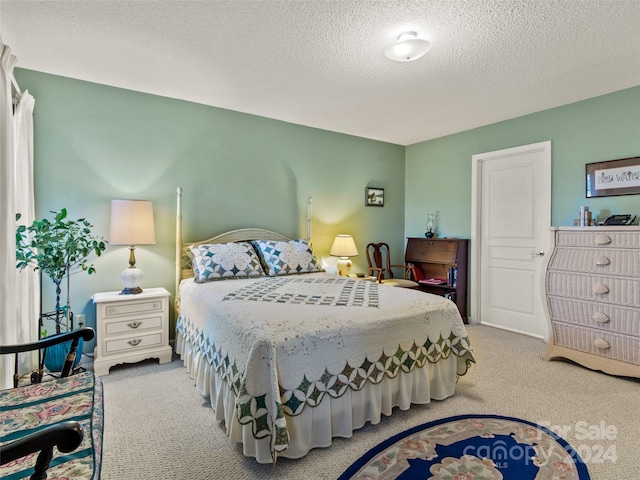 carpeted bedroom with a textured ceiling