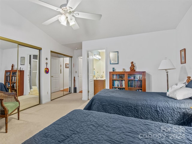 bedroom featuring carpet flooring, ceiling fan, connected bathroom, and vaulted ceiling