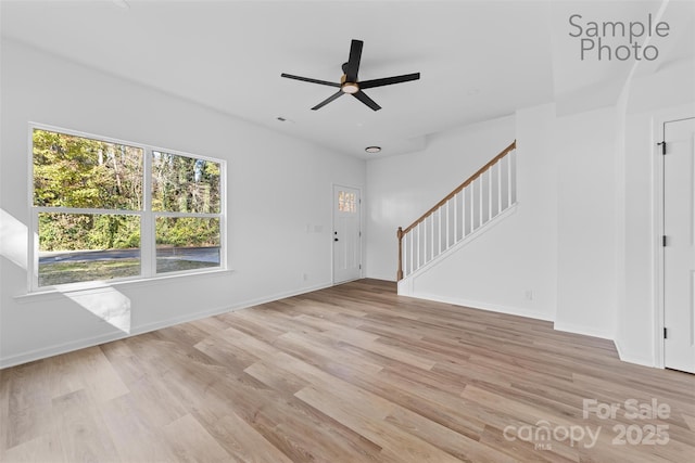 interior space with ceiling fan and light wood-type flooring