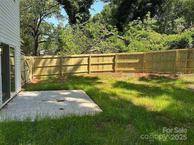 211 Chestnut St, Shelby, NC 28150 - view of yard featuring a fenced backyard and a patio area