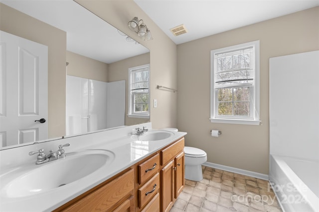 bathroom featuring vanity and toilet