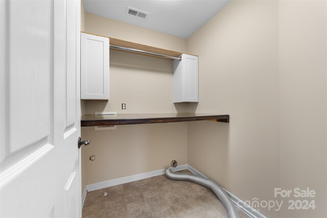 laundry room with cabinets