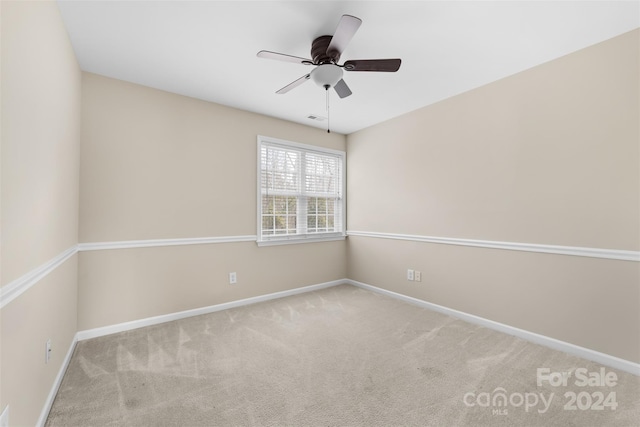 carpeted empty room with ceiling fan