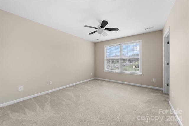 empty room featuring light colored carpet