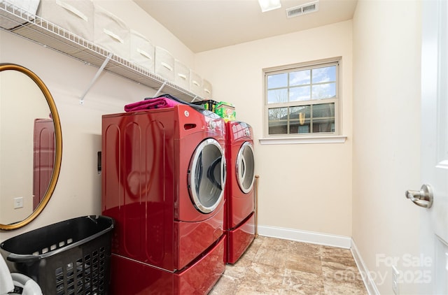 laundry area featuring washing machine and dryer