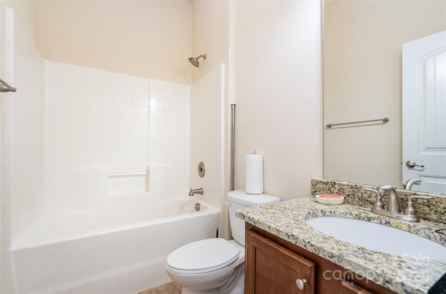 full bathroom featuring washtub / shower combination, vanity, and toilet