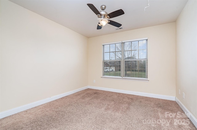 carpeted empty room with ceiling fan