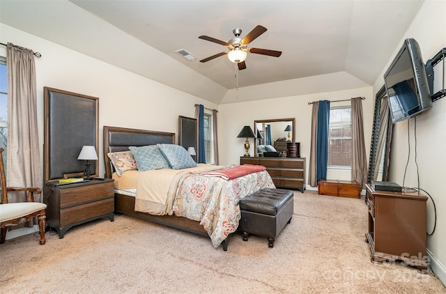 bedroom featuring ceiling fan, lofted ceiling, and light carpet