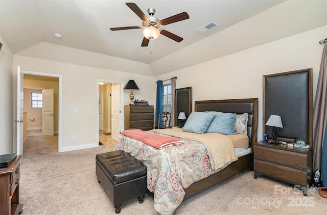 bedroom with ceiling fan, lofted ceiling, and light carpet