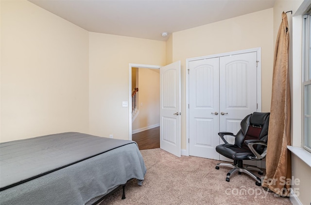 carpeted bedroom featuring a closet