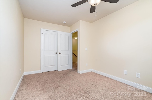 unfurnished bedroom with carpet flooring, a closet, and ceiling fan