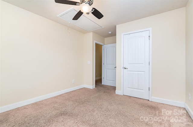 unfurnished bedroom featuring ceiling fan, light colored carpet, and a closet