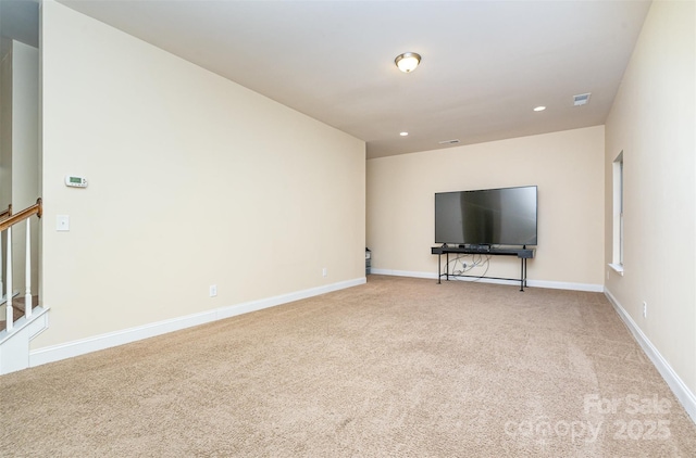 unfurnished living room with light carpet