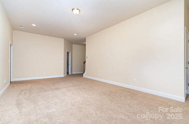 empty room with light colored carpet