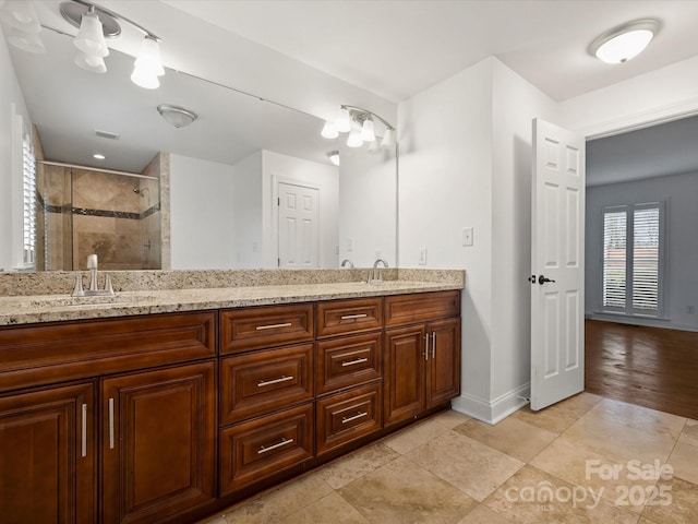 bathroom featuring vanity, tile patterned floors, and an enclosed shower