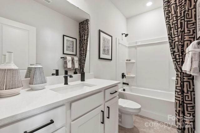 full bathroom featuring vanity, shower / bath combination with curtain, and toilet