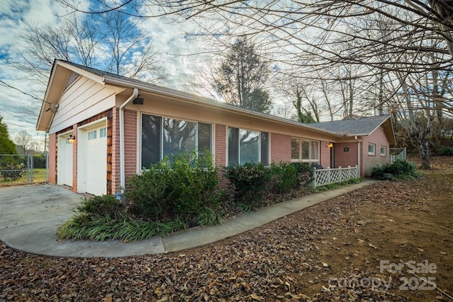 view of side of property featuring a garage