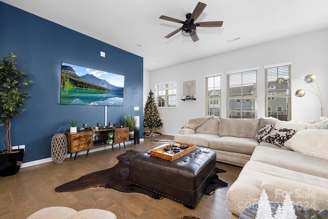 living room with ceiling fan and wood-type flooring