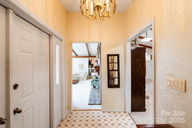 foyer entrance with an inviting chandelier