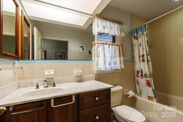 full bathroom with toilet, shower / tub combo with curtain, tasteful backsplash, tile walls, and vanity