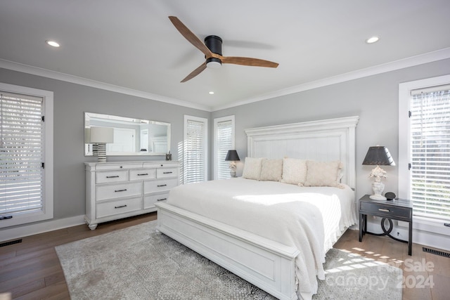 bedroom with multiple windows, hardwood / wood-style floors, ceiling fan, and ornamental molding