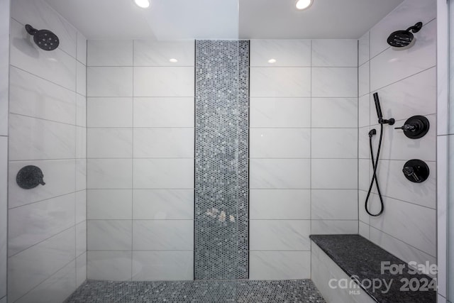 bathroom featuring tiled shower