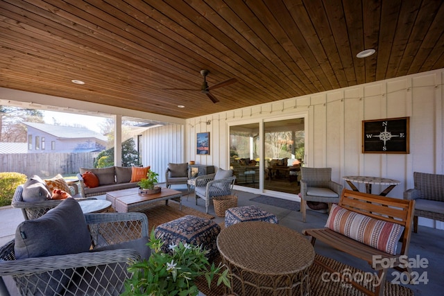 sunroom with ceiling fan and wood ceiling